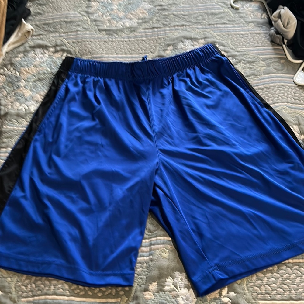 Men’s athletic shorts blue with a black strip on the sides spalding brand.